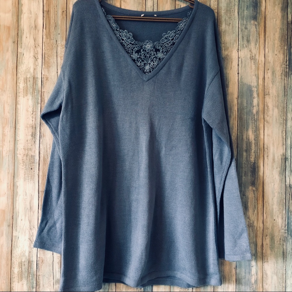 Blue sweater with crochet inset